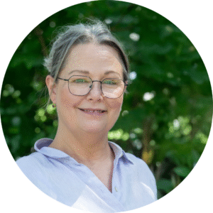 a photo of a caucasian woman with glasses
